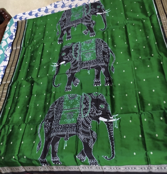 Intricately woven elephant motifs border and Aanchal with all over Blouse work Ikat Silk Saree