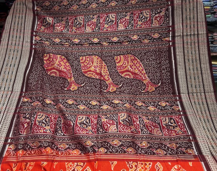 Master weaver s creation intricately woven conch motifs Cotton Ikat Saree