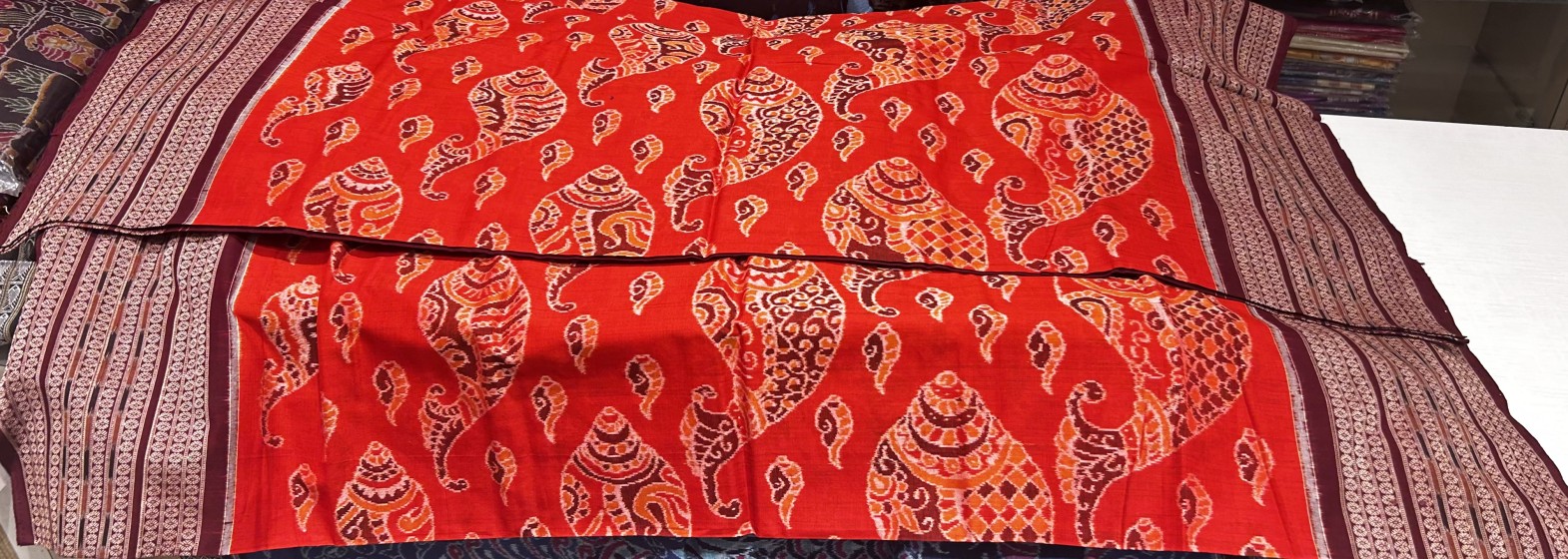 Master weaver s creation intricately woven conch motifs Cotton Ikat Saree