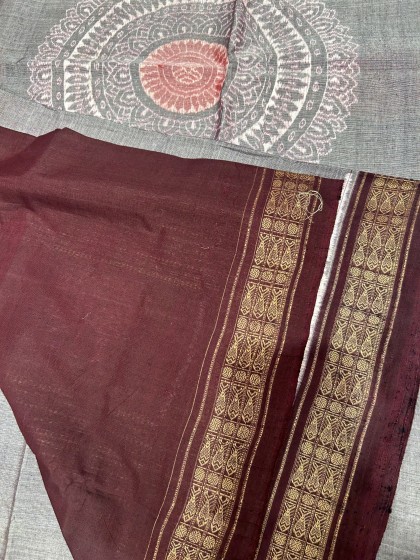 Centrally placed jhoti motifs on the body with elephant and lotus motifs Aanchal cotton Ikat saree